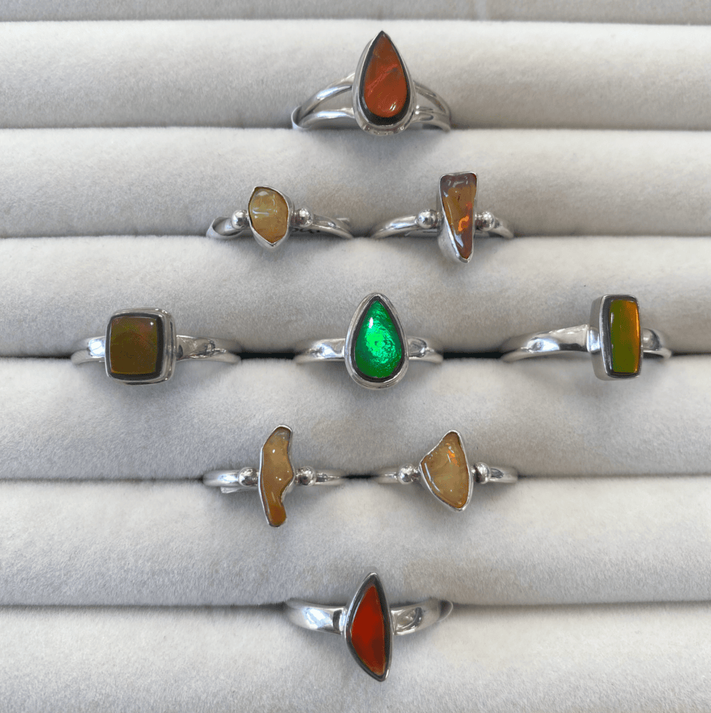 an assortment of sterling silver gemstone rings, Opal and Ammolite