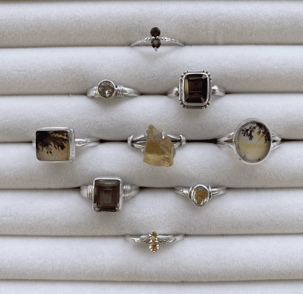 an assortment of sterling silver rings including faceted smokey quartz, Dendritic Agate, Citrine